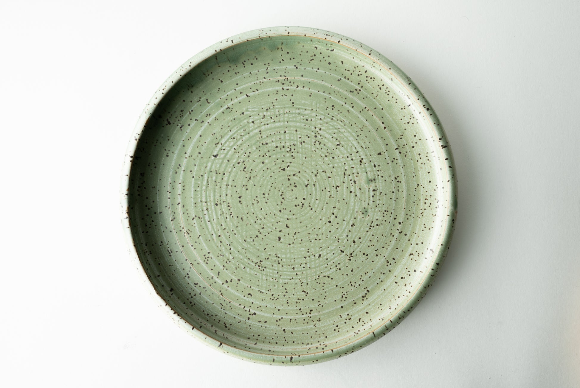 Handmade ceramic plate by MK Clayworks in Brevard, NC – minimalist, functional pottery crafted for everyday dining.