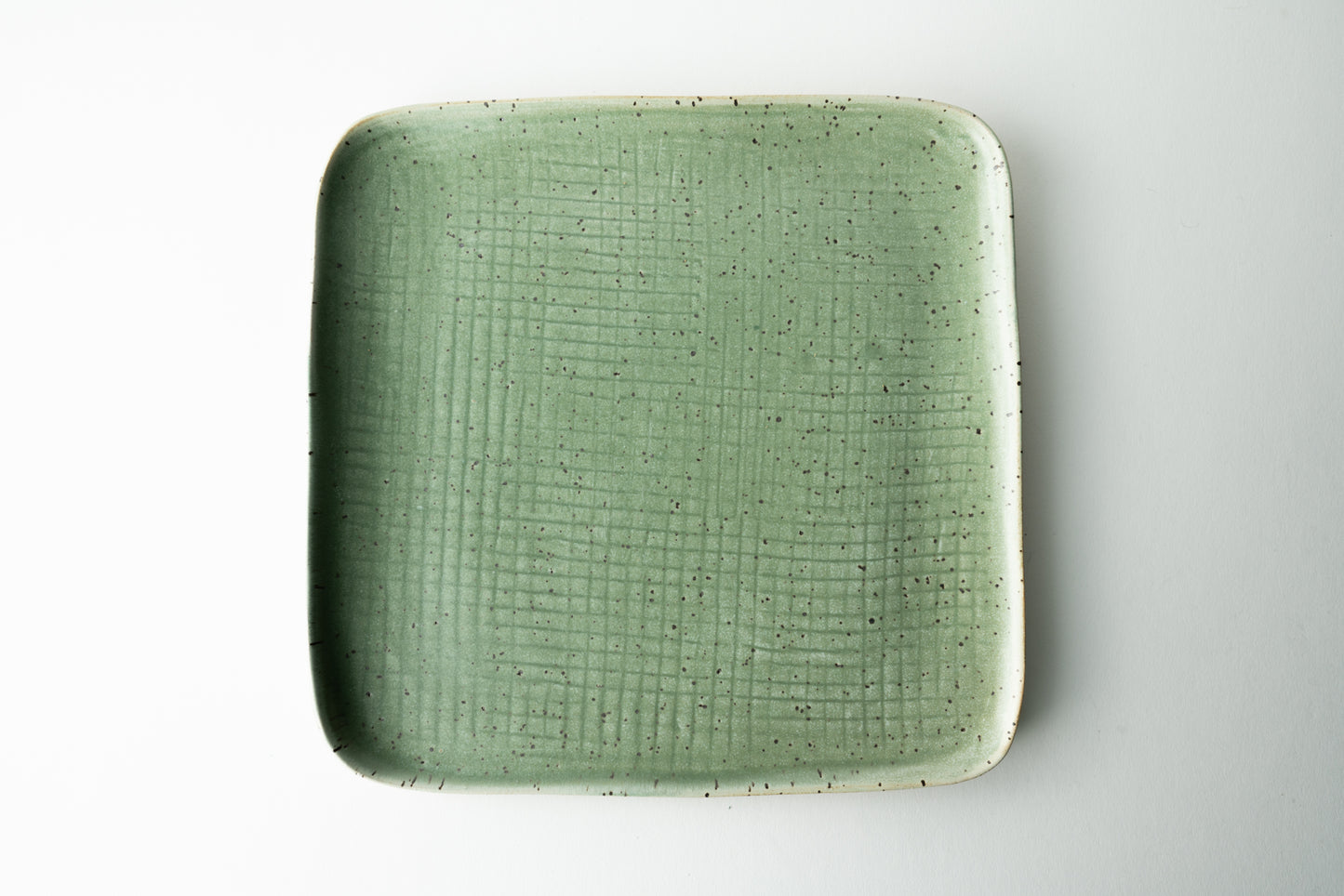 Handmade ceramic plate by MK Clayworks in Brevard, NC – minimalist, functional pottery crafted for everyday dining.