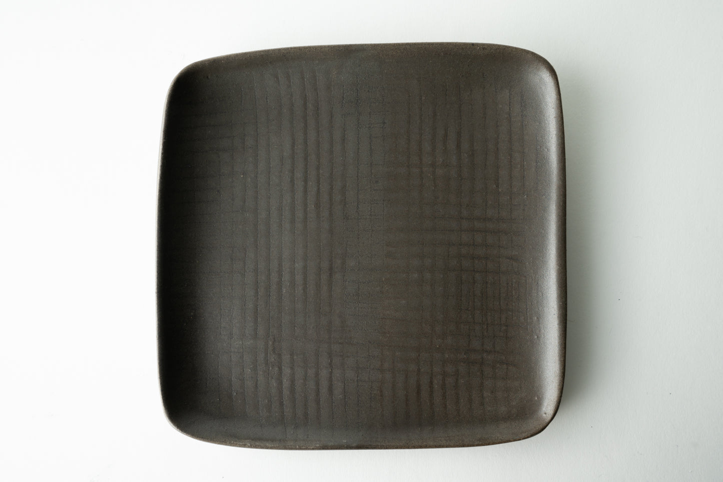Handmade ceramic plate by MK Clayworks in Brevard, NC – minimalist, functional pottery crafted for everyday dining.
