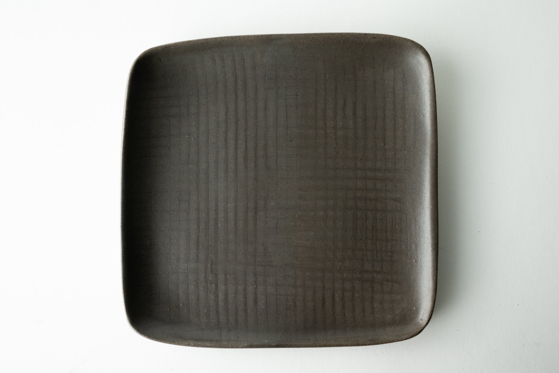 Handmade ceramic plate by MK Clayworks in Brevard, NC – minimalist, functional pottery crafted for everyday dining.
